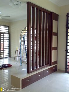 an empty room with wooden partitions in the middle