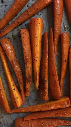 carrots with seasoning on them sitting on a table