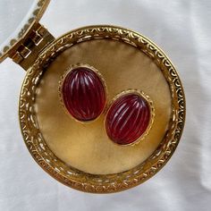 Very good vintage condition, signed, heavy with red glass cabochon. Rare find.Disclaimer: This item is an Estate/Antique Sale/Fair Find. Item is described to the best of my ability. Please contact me if you have any questions or wish to see additional photos prior to buying. Thank you! Vintage Oval Cabochons For Formal Occasions, Vintage Oval Gold Cabochons, Traditional Red Oval Earrings, Traditional Oval Red Earrings, Victorian Red Oval Cabochon Jewelry, Vintage Cabochon Clip-on Earrings For Formal Occasions, Vintage Formal Clip-on Cabochon Earrings, Antique Red Earrings For Formal Occasions, Victorian Red Oval Earrings