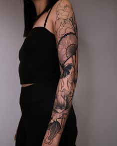 a woman with a tattoo on her arm