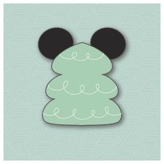 a green mickey mouse christmas tree with ears