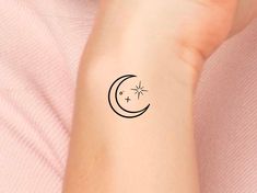 a woman's arm with a small tattoo design on the left side of her wrist