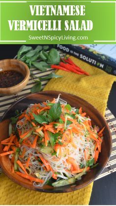 a salad with carrots, lettuce and other veggies in a bowl