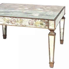 an ornately decorated table with mirrored top