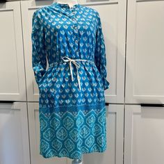 Anthropologie/ Meadow Rue - Blue Ikat Print Long Sleeve Cotton Dress / Size 8 Never Worn, Lightweight Blue Dress With Pretty Blue And White Ikat Print. Cinched Waist, Mother Of Pearl Button Top, Sleeves Can Be Worn Down Or Buttoned Up With Attached Strap Light Blue Casual Tunic Dress, Casual Light Blue Tunic Dress, Casual Turquoise Cotton Dress, Mid-length Blue Cotton Dress, Blue Mid-length Dress For Daywear, Casual Blue Midi Dress With Tie Waist, Blue Long Sleeve Midi Dress With Tie Waist, Casual Turquoise Knee-length Dress, Blue Cotton Midi Dress With Tie Waist