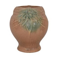 a brown vase with an intricate design on it