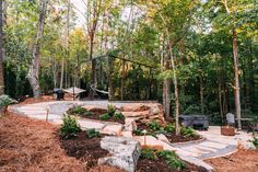 a stone path in the middle of a forest