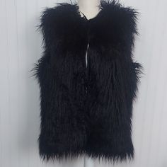 Inc International Concepts Macy's Faux Fur Black Vest 4 Hook Eye Latches 80% Modacrylic 20% Polyester Lining: 100% Polyester Measurements Approx: Pit To Pit: 23" Length: 27" Nwt Black Faux Fur Outerwear For Spring, Black Faux Fur Outerwear For Work, Spring Black Faux Fur Outerwear, Oversized Black Outerwear With Faux Fur Trim, Black Faux Fur Coat With Faux Fur Trim, Black Fur Trim Cardigan, Black Faux Fur Vest, Black Long-sleeved Outerwear With Tassels, Faux Fur Vest Black