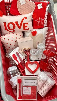 a shopping cart filled with lots of valentine's day items and gifts for her