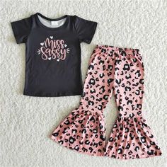 "95% Cotton 5% Spandex The shirt is pink with \"MISS SASSY\" printed on the frontside. The pants have elastic in the waist and a fun leopard print on them. Your SASSY girl will rock this outfit proudly!" Dolly Parton Outfits, Bells Outfit, Bell Pants Outfit, Leopard Pants Outfit, Bell Bottom Pants Outfit, Cheetah Clothes, Leopard Outfits, Sassy Outfit