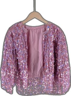 Pink Long Sleeve Outerwear For Party Season, Glamorous Pink Sequined Outerwear, Pink Sequined Outerwear For Winter, Pink Embellished Winter Outerwear, Pink Sequined Outerwear For Spring, Fitted Pink Outerwear For Festive Occasion, Pink Spring Festive Outerwear, Spring Festive Pink Outerwear, Tinsel Jacket