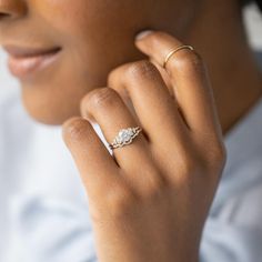 a close up of a person wearing a ring