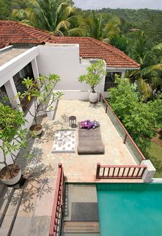 an aerial view of a house with a pool