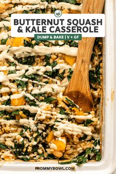 butternut squash and kale casserole in a baking dish with a wooden spoon