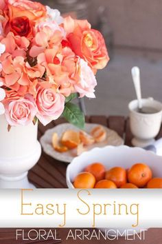 an easy spring floral arrangement with oranges and roses