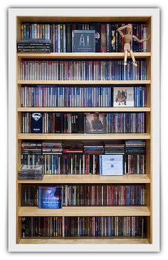 a book shelf filled with lots of dvds