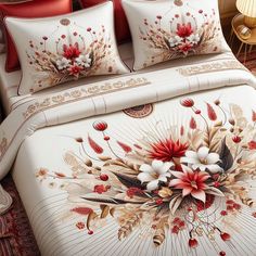 a bed covered in white and red comforters with flowers on it's side