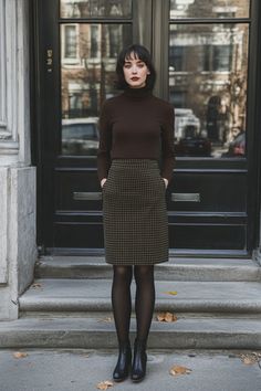 Office chic meets winter warmth. This olive houndstooth pencil skirt paired with a dark brown turtleneck and black tights is the perfect blend of style and comfort. Perfect for those chilly office days. Winter Skirt Tights Outfit, Houndstooth Pants Outfit Winter, Autumn Outfits With Tights, Plaid Midi Skirt Outfit Winter, Brown Skirt Black Tights, Brown Houndstooth Skirt Outfit, Midi Skirt With Tights, Gray Pencil Skirt Outfit, Sweater Office Outfits