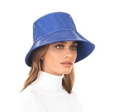 Of all woman's rain hats for sale online, Patti Bucket is a standout! The sleek outer shell of patent vinyl completely repels water and is fully lined so you can stay dry and protect your hair in the heaviest of down pours. The underside of the brim is faced with water-repellent canvas, keeping the shape crisp, yet still sufficiently flexible for rolling it up and stowing it in your bag when you are not wearing it. The classic bucket silhouette flatters your face and adds modern flair to any rai Rain Hats, Eric Winter, White Raspberry, Leather Beret, Natural Blush, Rain Hat, Art Costume, Designer Hats, Women's Headwear