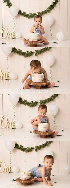 a baby boy sitting on top of a cake in front of balloons and garlands