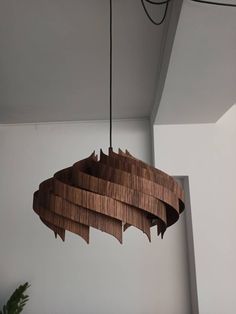 a wooden chandelier hanging from the ceiling