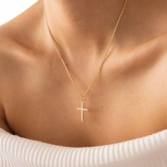 The handmade cross necklace is a special piece of jewelry distinguished by its elegance and craftsmanship. Adorned with high-quality zircon stones, each detail is meticulously designed. The cross shape, imbued with symbolic significance, enhances the aesthetic value of the design. Each zircon stone in the necklace captures attention with its sparkle, reflecting light beautifully. Handmade, each piece is unique; every detail is Made with care and assembled with precision. This necklace is ideal f Cubic Zirconia Cross Necklace With Clavicle Chain, Cubic Zirconia Crucifix Jewelry Gift, Diamond Crucifix Cross Necklace As Gift, Diamond Crucifix Cross Necklace For Gift, Cubic Zirconia Cross Pendant Necklace As A Gift, Diamond Crucifix Necklace As Gift, Gift Cubic Zirconia Cross Necklace, Cubic Zirconia Crucifix Necklace For Gift, Dainty Cross Necklace In Cubic Zirconia