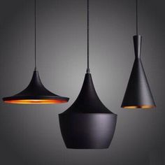 three hanging lights with different shapes and colors