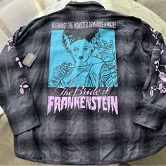 Halloween Frankenstein Bride Shirt Size Medium But Fits Small & Roomy Enough To Fit Sizes Large Frankenstine Shirt, Edgy Oversized Tops For Halloween, Relaxed Fit Long Sleeve Shirt For Halloween, Gray Shirt For Fall Streetwear, Fall Grunge Shirt With Graphic Print, Grunge Graphic Print Shirt For Fall, Fall Grunge Graphic Print Shirt, Long Sleeve Halloween Streetwear Shirt, Black Long Sleeve Halloween Shirt