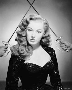 Medium publicity shot of Eleanor Parker as Lenore, with crossed fencing swords/foils in background. 50s Hair, Cabelo Pin Up, Eleanor Parker, Retro Updo, Brothers Wedding, 1950s Hairstyles, 1940s Hairstyles, Retro Makeup, Make Up Inspiration