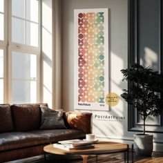 a living room with a couch, coffee table and large poster hanging on the wall