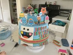 a birthday cake with cartoon characters on it