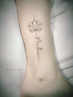 a woman's foot with a tattoo on it that reads, i love you