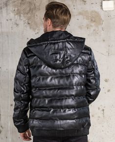 JERONE black men's winter jacket. For those of you who want something more special from your winter coat! A nice, shiny surface with a transverse seam, which creates a special effect on the jacket. High-quality, sturdy and thick fabric that will last you through winter and late autumn. The jacket has a zipper fastening, a logo on the chest and two front pockets with zippers. The hood is removable (with a zipper), so the jacket can also be made into a bomber model. The jacket has a hip pocket. El Modern Black Puffer Jacket For Fall, Black Hooded Techwear Leather Jacket, Black Leather Jacket With Detachable Hood For Streetwear, Black Biker Jacket With Detachable Hood For Streetwear, Modern Black Puffer Jacket For Cold Weather, Black Modern Puffer Jacket For Cold Weather, Urban Biker Jacket With Detachable Hood For Winter, Urban Black Biker Jacket With Double-lined Hood, Black Biker Outerwear With Double-lined Hood