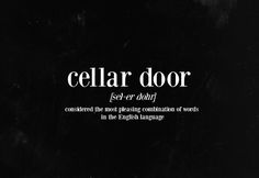 a black and white photo with the words cellar door written in bold, cursive font