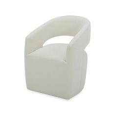 a white chair sitting on top of a white floor