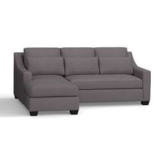 a gray couch and ottoman on a white background