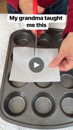 someone is cutting out a piece of paper in a muffin pan with the words, my grandma taught me this