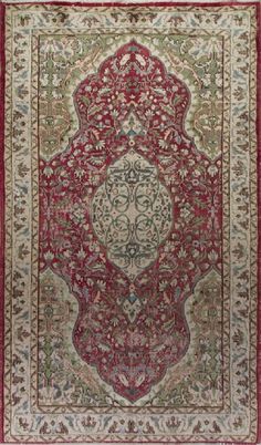 This vintage hand knotted mid-20th century area rug from Western Anatolia boasts a curvilinear medallion in ivory against a field in burgundy, filled densely with swirling leafy vines and floral heads in bright light blue, sage green and ivory. The four arabesque corner pieces in bright celadon green are quite large and adorned with large swirling angular leaves and floral heads. Their elegant arabesque outlines seem to create a space similar to a symmetrical archway at both ends of the field. T Burgundy Rug, Celadon Green, Medallion Design, Patchwork Rugs, Floral Theme, Turkish Carpet, Beautiful Pillows, Flag Design, Wool Carpet