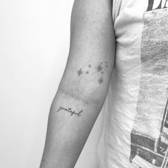 a person with a tattoo on their arm