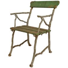 an old green wooden chair sitting on top of a white floor