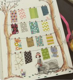 an open notebook with clothes hanging on the clothesline