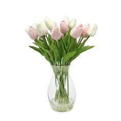 a vase filled with pink and white tulips