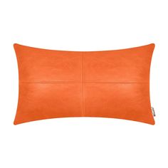 an orange leather pillow on a white background