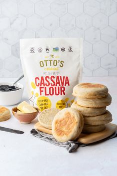 a bag of cassava flour sitting on top of a cutting board next to sliced bread