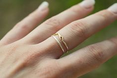 A handmade Mountain ring made of raw brass and sterling silver, 1 mm thick and a 1 mm minimal sterling silver stacking ring Stackable rings Will come in a eco friendly wrap ready to be given as a gift. Shipping includes tracking number. Shipping to the U.S. and Europe : 7 to 14 Silver Dainty Brass Rings, Dainty Silver Brass Rings, Silver Brass Stackable Rings For Promise, Mixed Metal Ring, Mountain Ring, Two Tone Ring, Mixed Metal Rings, Sterling Silver Stacking Rings, Silver Stacking Rings