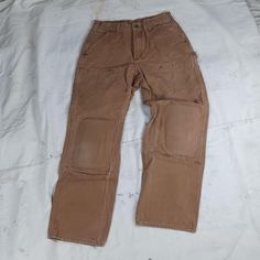 Nice pair of brown cotton canvas Carhartt double front carpenter work pants....made in Mexico.  There are rubber pads covering the knees which could be taken out if you so desire. The pants are tagged 31 x 30 but are currently 30 inch waist29 inch inseam11 inch rise. Very nice condition and worn in just right. No holes or fraying....no stains. Carhartt Double Knee Pants Women, Carhartt Double Knee, Carpenter Work, Canvas Work, Grand Junction, Duck Canvas, Vintage Carhartt, Work Pants, Cotton Canvas