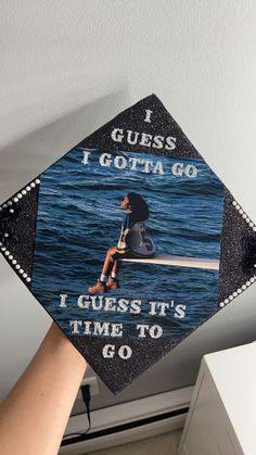 someone is holding up a graduation cap that says i guess it's time to go