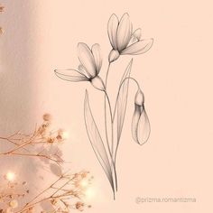 a drawing of three flowers on a white wall next to some branches with lights in the background