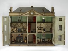 a doll house with furniture and accessories in it