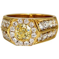 Men's Cushion cut diamonds, Micro Bead Set Ring. Intricate Craftsmanship, Hexagon Deck. GIA Certified 1.05ct. natural cushion cut center diamond. Fancy Yellow / VVS-1 clarity. Report: 6232044103 Side round diamond Accents Total Weight: 1.90ct. vs-2 clarity / G-color Natural, Earth Mined. 18kt. yellow gold 17.3 grams. Deck of ring: 10mm diameter Depth: 5.7mm current ring size: 8.5 We may resize, please inquire $35,000 Appraisal Certificate & GIA Certifiecate Luxury Yellow Gold Men's Ring With Brilliant Cut, Luxury Yellow Gold Statement Men's Ring, Luxury Men's Yellow Gold Ring With Brilliant Cut, Luxury Vintage Diamond Men's Ring, Luxury Antique Men's Diamond Ring, Luxury Men's Yellow Gold Cubic Zirconia Ring, Luxury Gia Certified Men's Jewelry, Luxury Men's Jewelry With Halo Setting, Luxury Men's Yellow Gold Diamond Ring